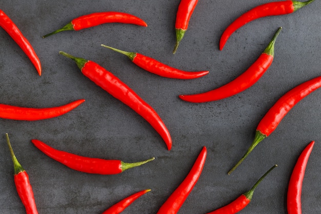 Flat lay composition with red hot chilli peppers