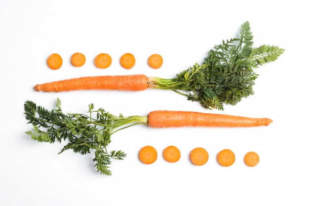 Flat lay composition with ripe fresh carrots 