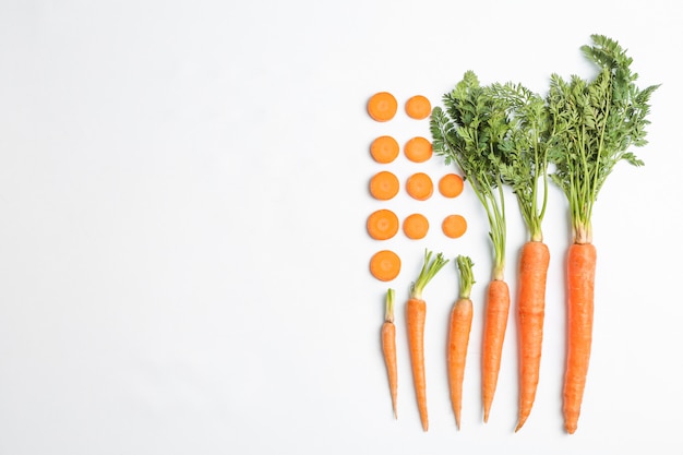 Flat lay composition with ripe fresh carrots 