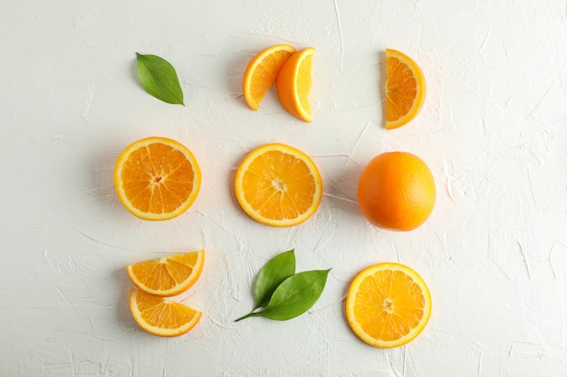 Flat lay composition with ripe oranges on white background. Top view