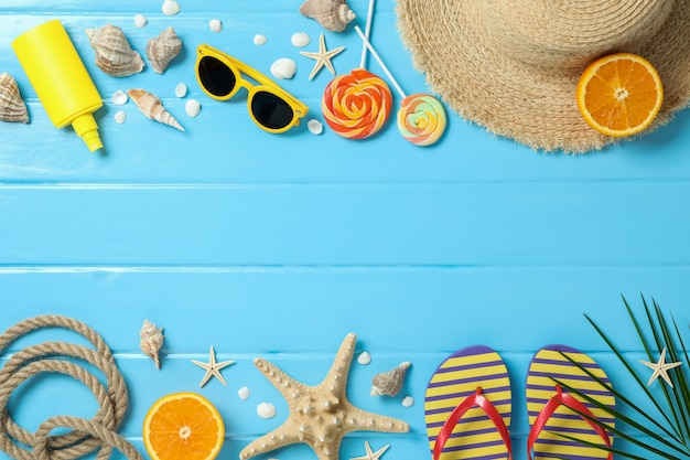 Flat lay composition with summer vacation accessories on color background, space for text and top view. Happy holidays