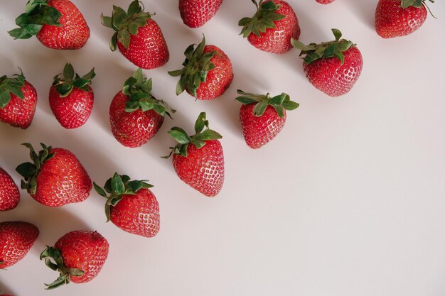 Flat lay composition with with tasty ripe strawberries on white background