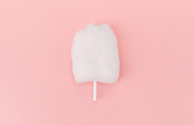 Flat lay of cotton candy isolated on pink surface