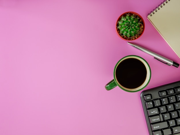 Flat lay cute pink office desk with copy space