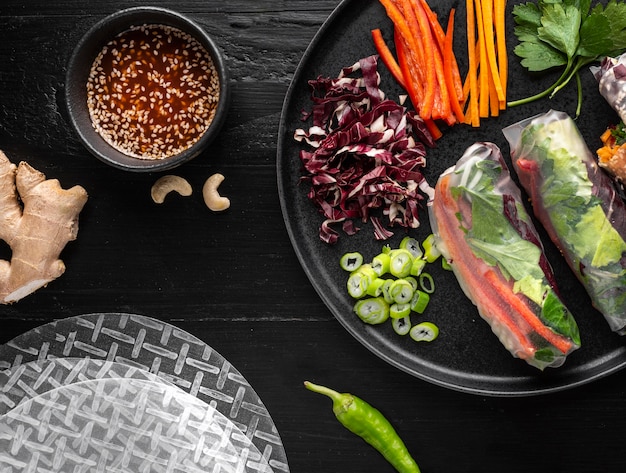 Photo flat lay of delicious spring rolls concept