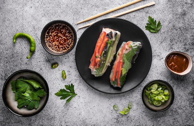 Photo flat lay of delicious spring rolls concept