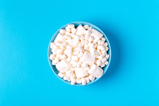 Flat lay of delicious white marshmallows bowl