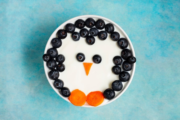 Photo flat lay delicious yogurt with blueberries