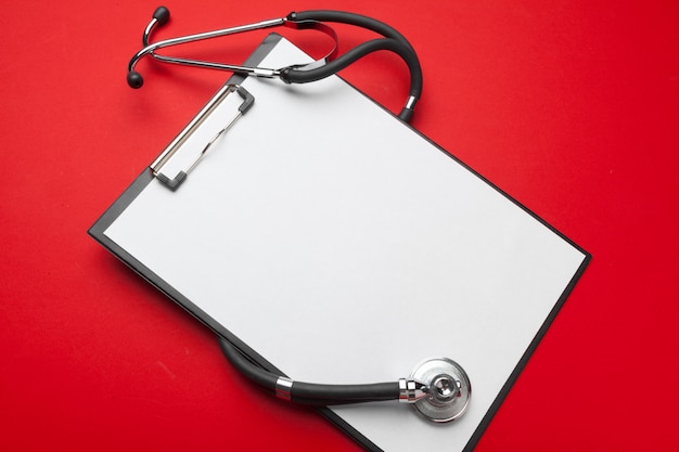 Flat Lay Design Of Stethoscope And Blank Clipboard Pad With For Medical Concept.