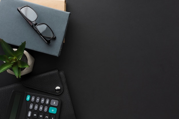 Flat lay of desktop with agenda and glasses