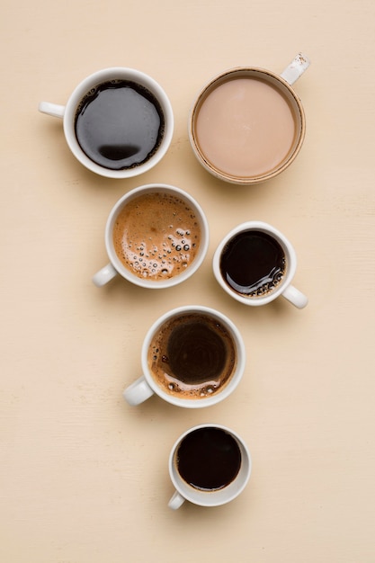 Flat lay different cups of coffee arrangement