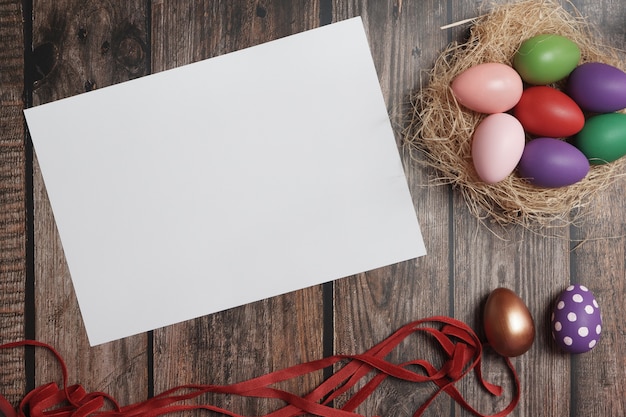 Flat-lay Easter eggs on wooden table.