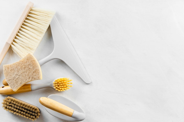 Flat lay of eco cleaning brushes with copy space