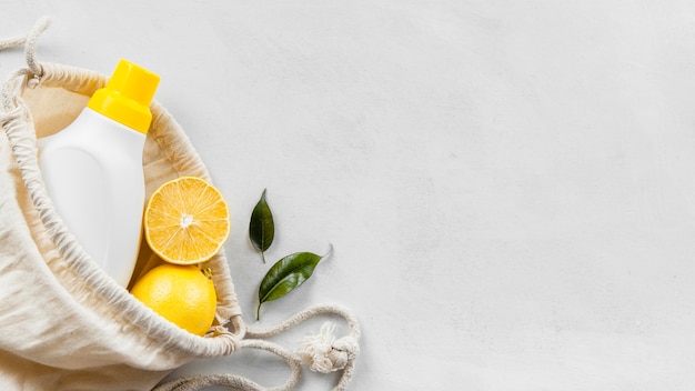 Photo flat lay of eco-friendly cleaning products collection with lemon and copy space