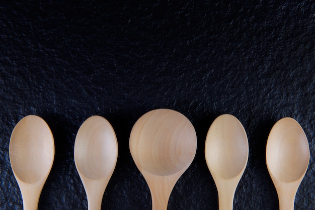 Flat lay An empty wooden spoon, five pieces