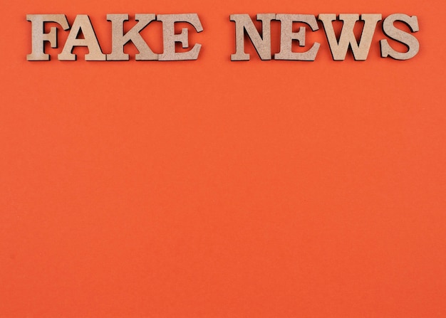 Flat lay false news concept with copy-space