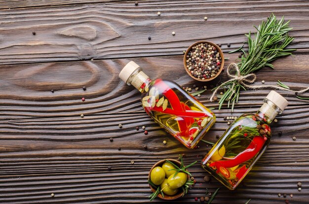 Flat lay Food background frame made of oils condiments and spices on kitchen table. Cooking concept with copy-space