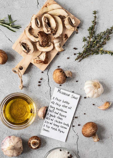 Flat lay of food ingredients with mushrooms and oil