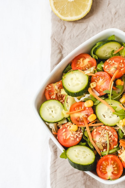 Flat lay of fresh tasty salad, healthy eating, dieting, vegetarian, vegan. Copy space. 