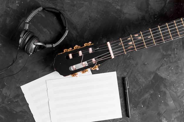 Photo flat lay of guitar and music notes