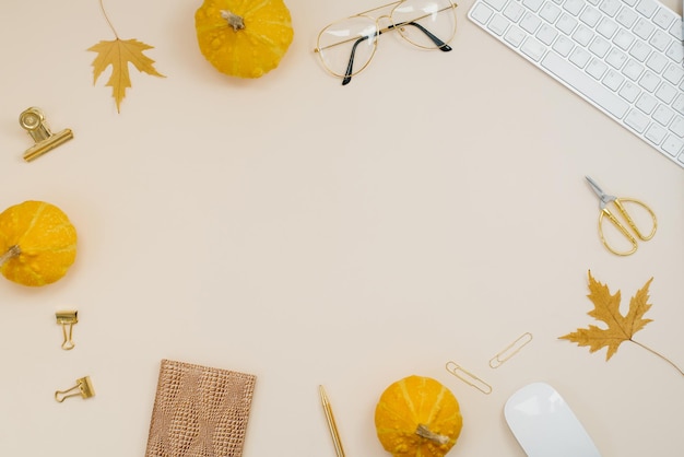 Flat lay home office desk Freelancer or blogger workplace with computer yellow pumpkins