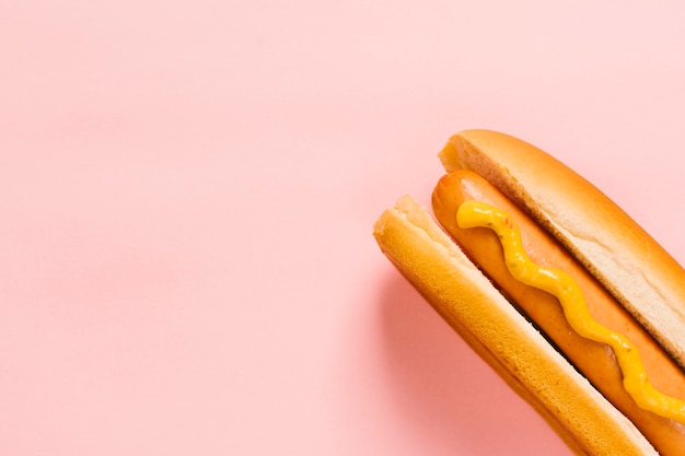 Flat lay hotdog with mustard copyspace