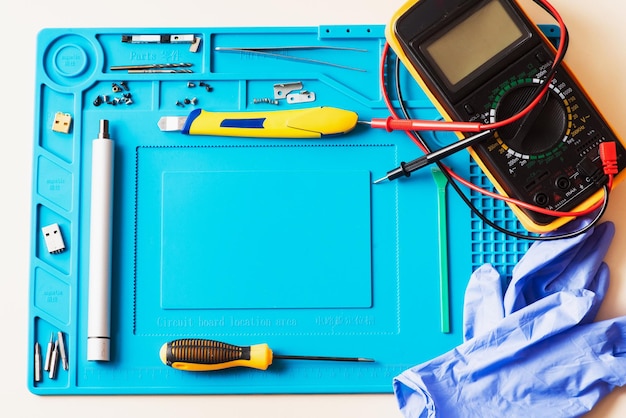 Flat lay image of dismantling the broken smart phone for preparing to repair or replace some components Top view