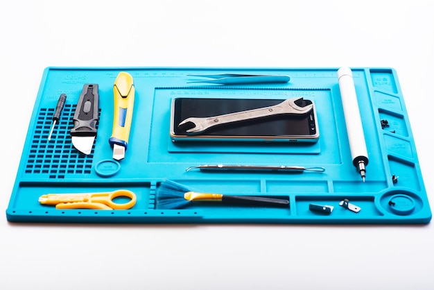 Flat lay image of dismantling the broken smart phone for preparing to repair or replace some components Top view