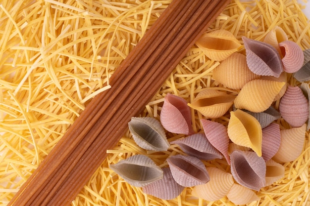 Flat lay image of varius tipe of pasta and spagetti for backgrounds and wall art