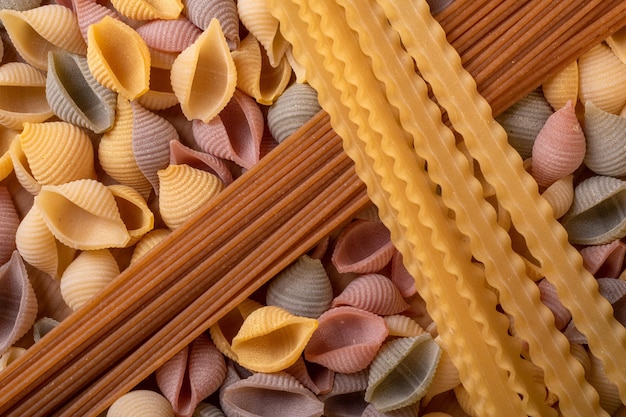 Flat lay image of varius tipe of pasta and spagetti for backgrounds and wall art