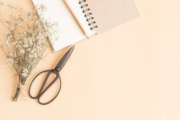 flat lay image of workplace with empty notebook,Yellow paper  notebook with pencil