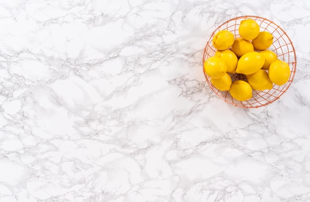 Flat lay. Ingredients in glass mixing bowls to prepare lemon bundt cake.