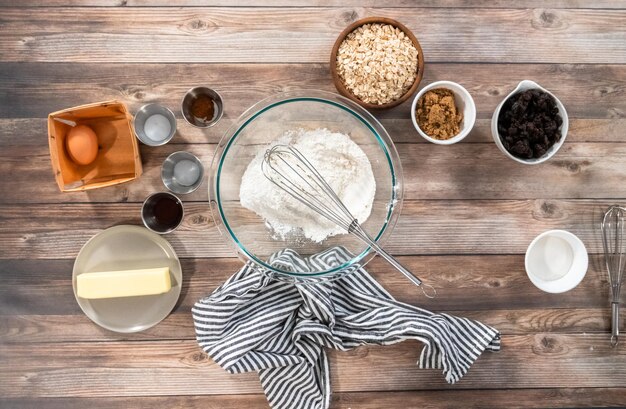 Flat lay. Ingredients to make chewy oatmeal raisin cookies.