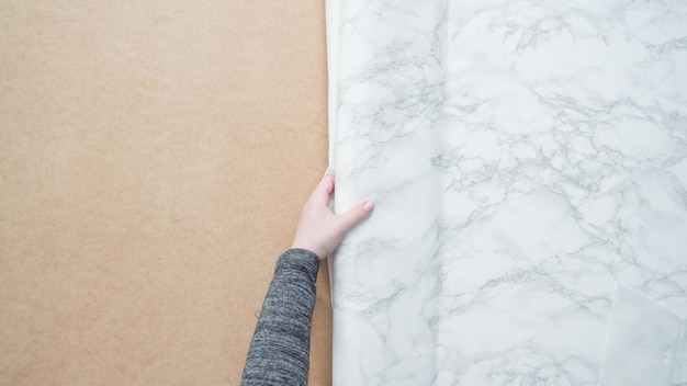 Flat lay. Making marble board with adhesive paper for food photography.