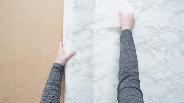 Flat lay. Making marble board with adhesive paper for food photography.