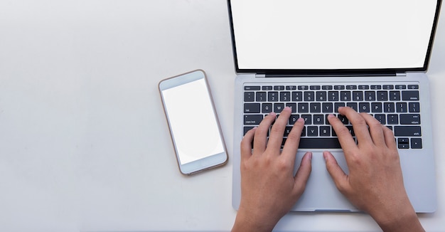 Flat lay  man pushed the keyboard with a notebook computer on white background