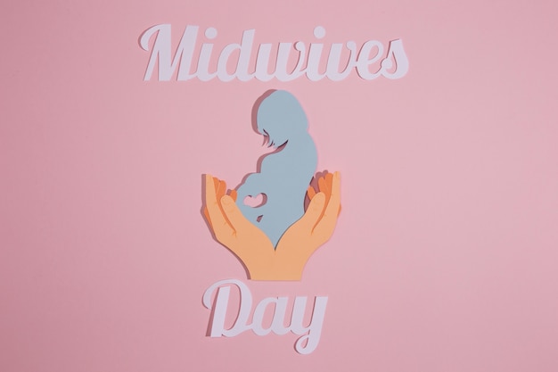 Photo flat lay midwives day celebration with pink background