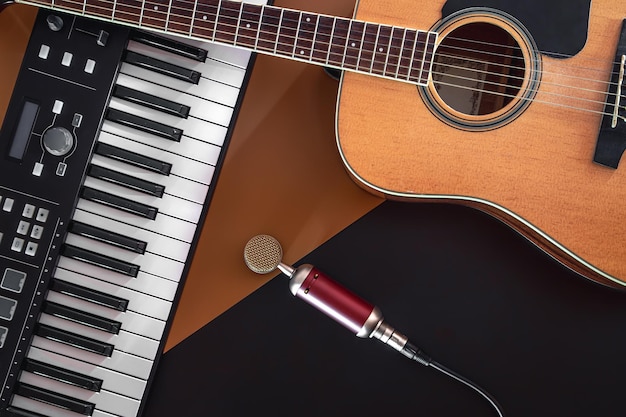 Flat lay music background with acoustic guitar and piano