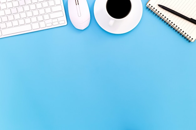 flat lay Office desk table of modern workplace with laptop on blue table, top view laptop background and copy space on black background, blue desk office with laptop,