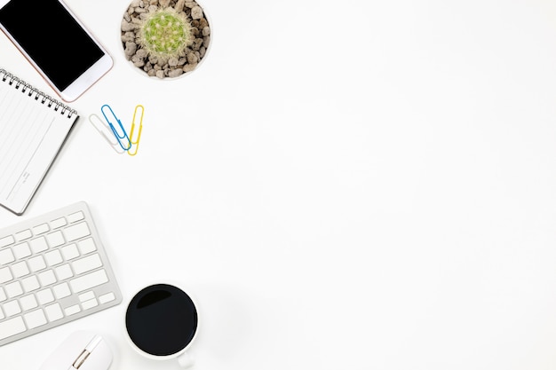 Flat lay Office desk table of modern workplace with laptop on white background, top view