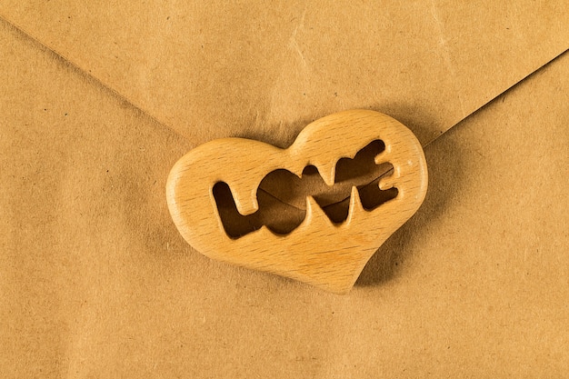 Flat lay of paper old style envelop with heart.