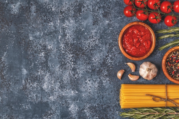 Flat lay of pasta, spices and vegetables