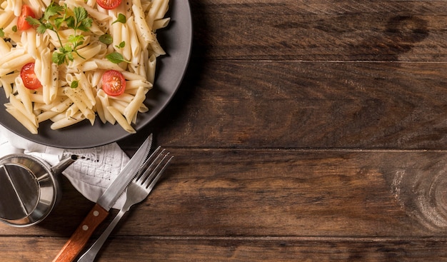 Flat lay pasta with vegetables and copy-space