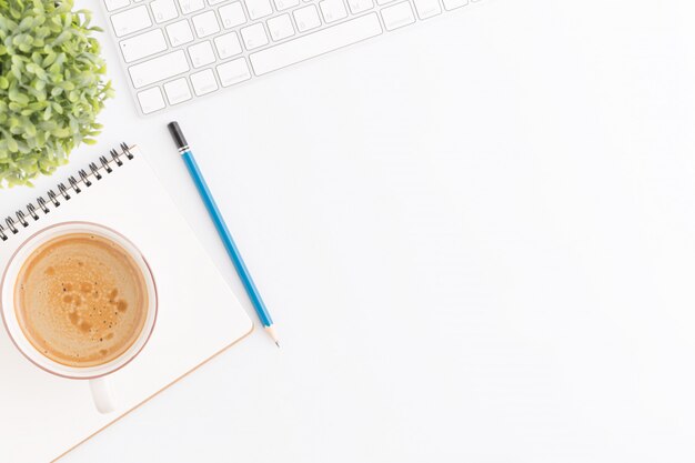 Flat lay photo of office desk with mouse and pencil on white background