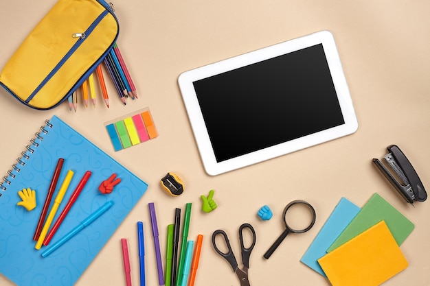 Flat lay photo of workspace desk with school accessories or office supplies