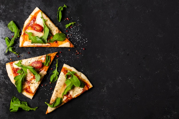 Photo flat lay of pizza slices with copy space