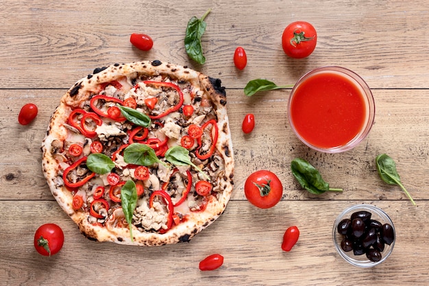 Flat lay pizza on wooden background