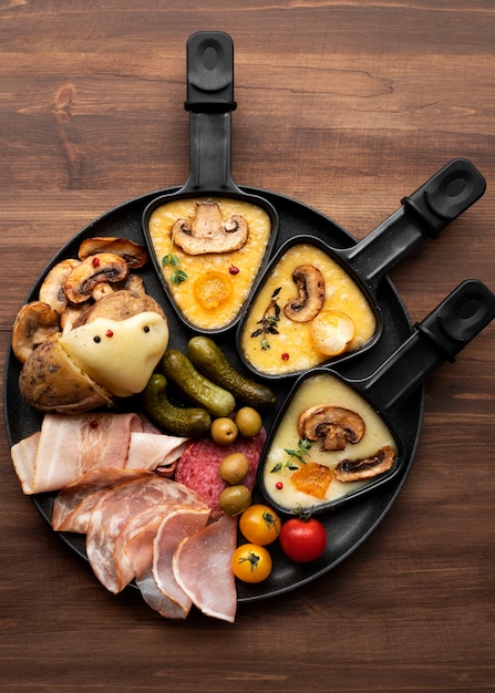 Photo flat lay of raclette dish with ingredients and delicious food