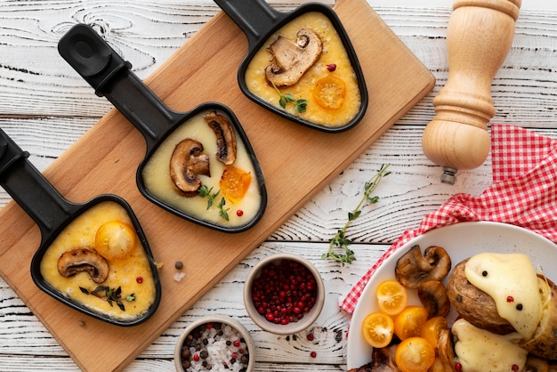 Photo flat lay of raclette dish with ingredients and delicious food