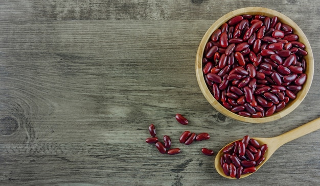 Flat lay red beans on wooden table and copy space